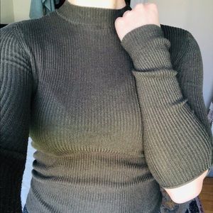 Tight knit sweater with peek-a-boo elbows